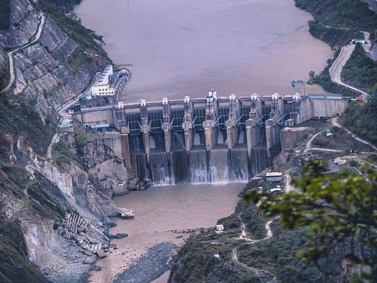 Licensed photograph of the 330 MW Alaknanda hydroelectric project illustrating Adani Power’s GVK Energy resolution-plan LoI.