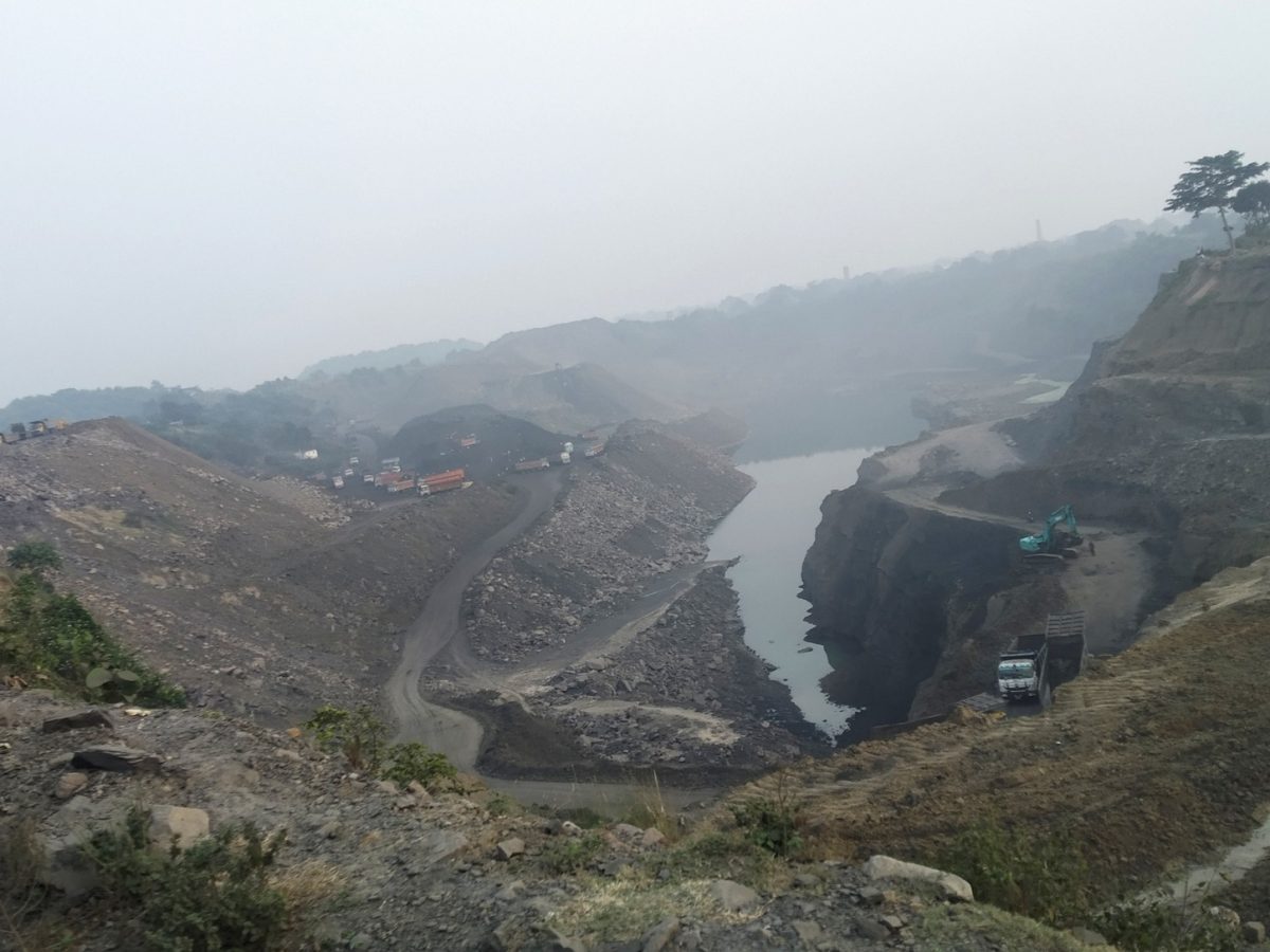 Coal Ministry auction context shown through an active open-cast coal mine in Jharkhand, India.