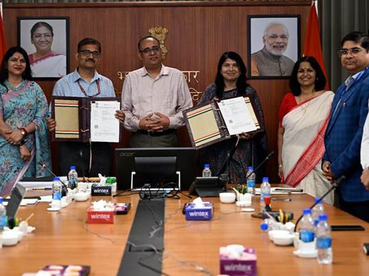 Officials signing the agreement that creates Pension Sakhis for rural retirement awareness and NPS support