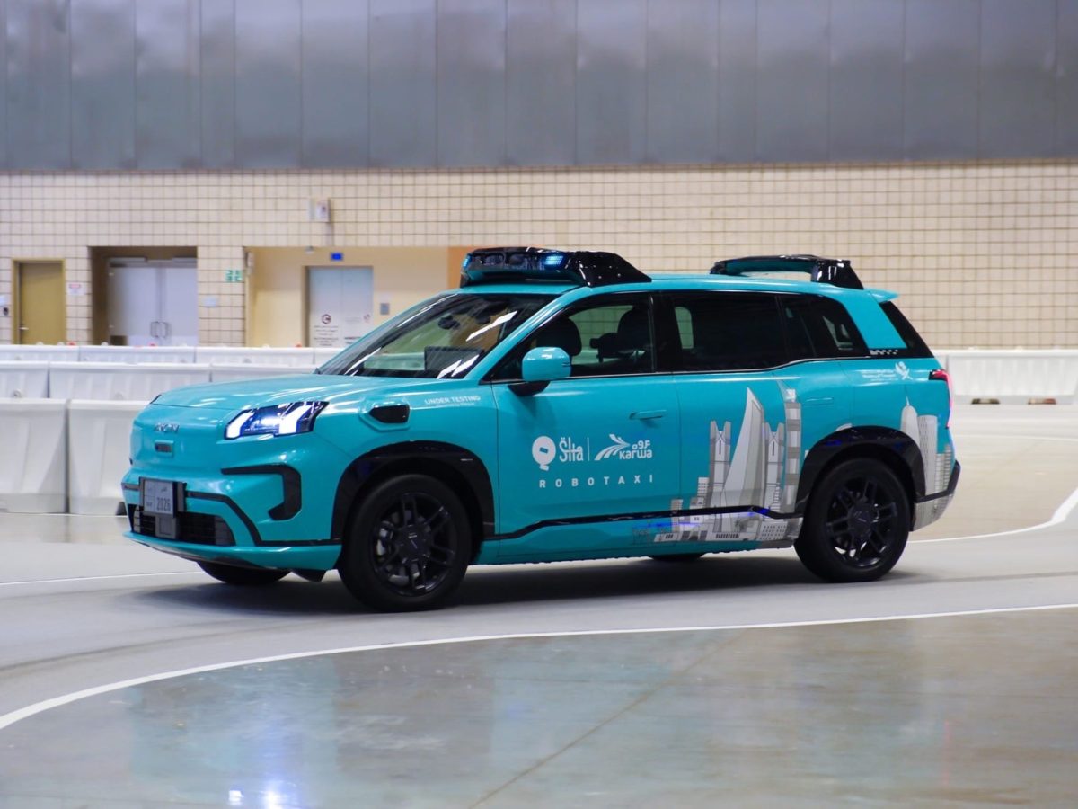 Pony.ai Doha robotaxi Gen-7 vehicle at the Qatar forum in an exact official event photograph.