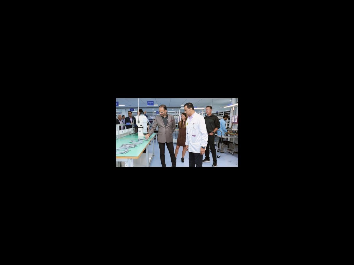RUCKUS Pune manufacturing shown in the exact official photograph of staff inspecting networking production at Belden’s Pune facility.