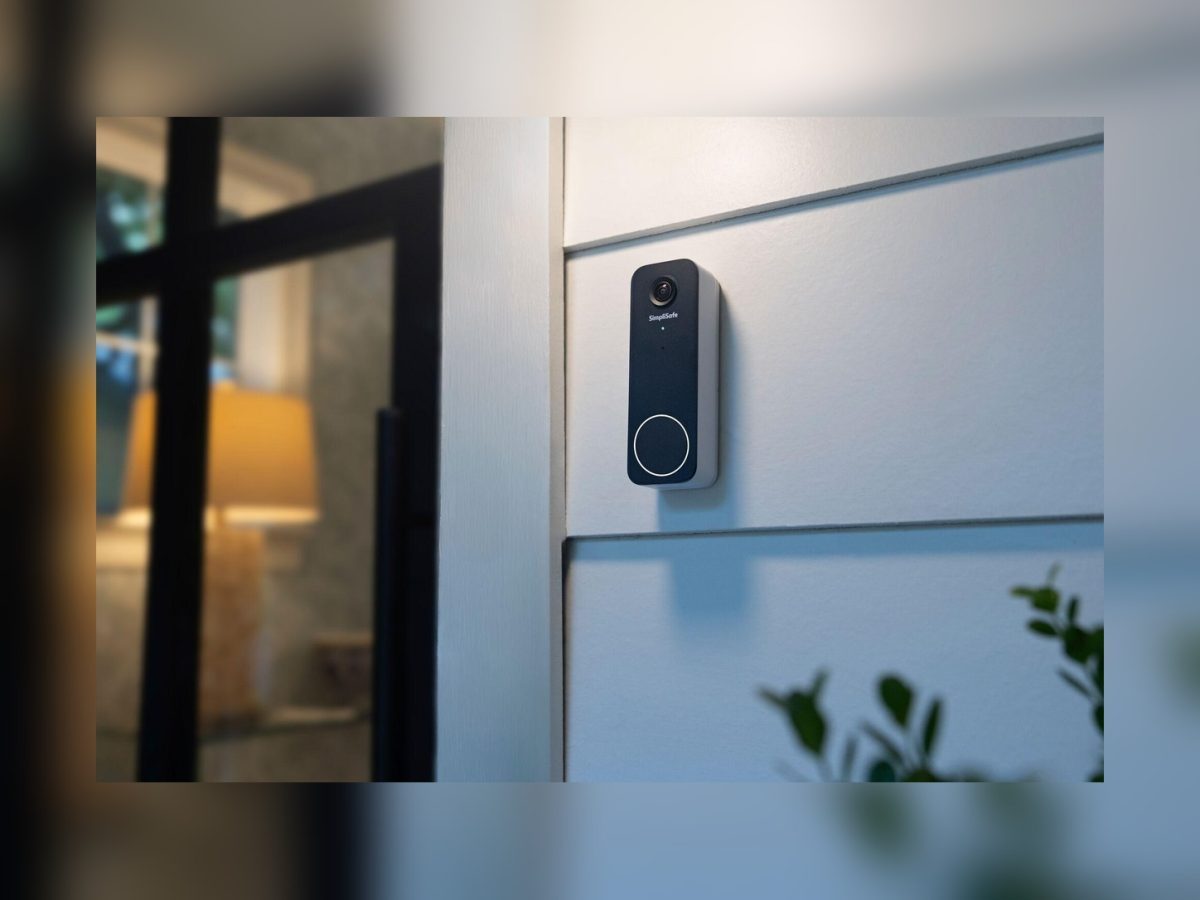 SimpliSafe Video Doorbell Series 2 installed beside a front door in an official product photograph.